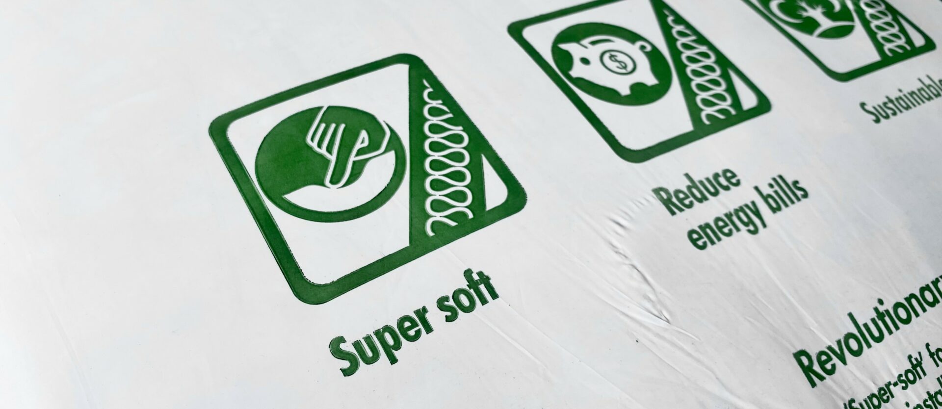 Knauf Earthwool Insulation packaging shows the benefits of the insulation, including being "Super Soft", and "Reducing Energy Bills"