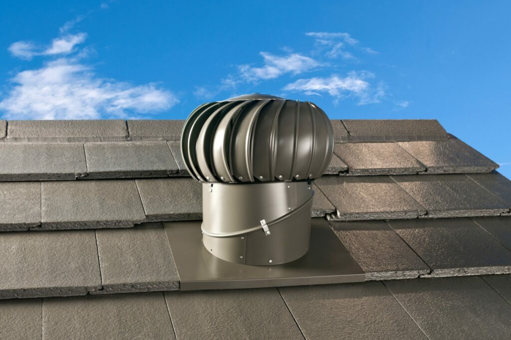 A grey, matte Bradford Ventilation whirly bird on a roof.