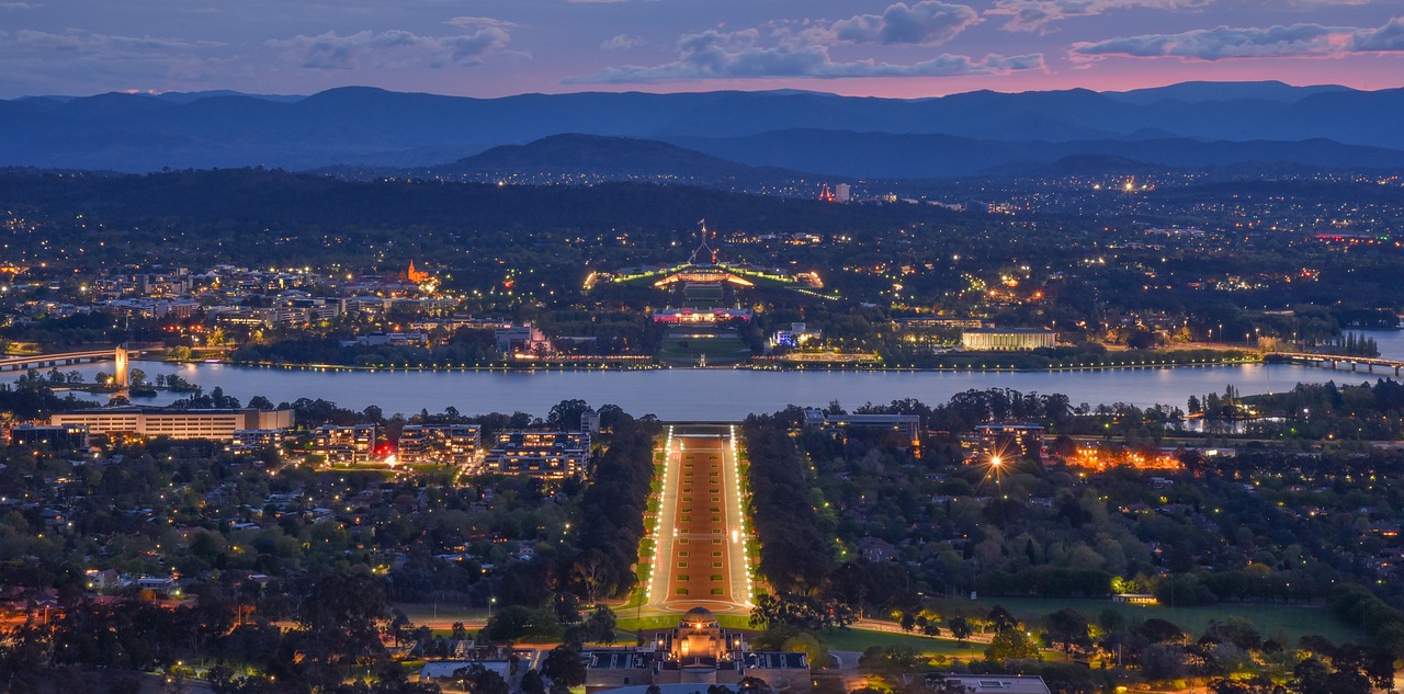 A night time photo of Canberra city, where our Canberra insulation installers service